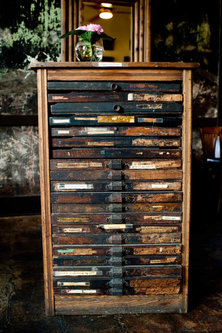 A wooden cupboard with a lot of markings